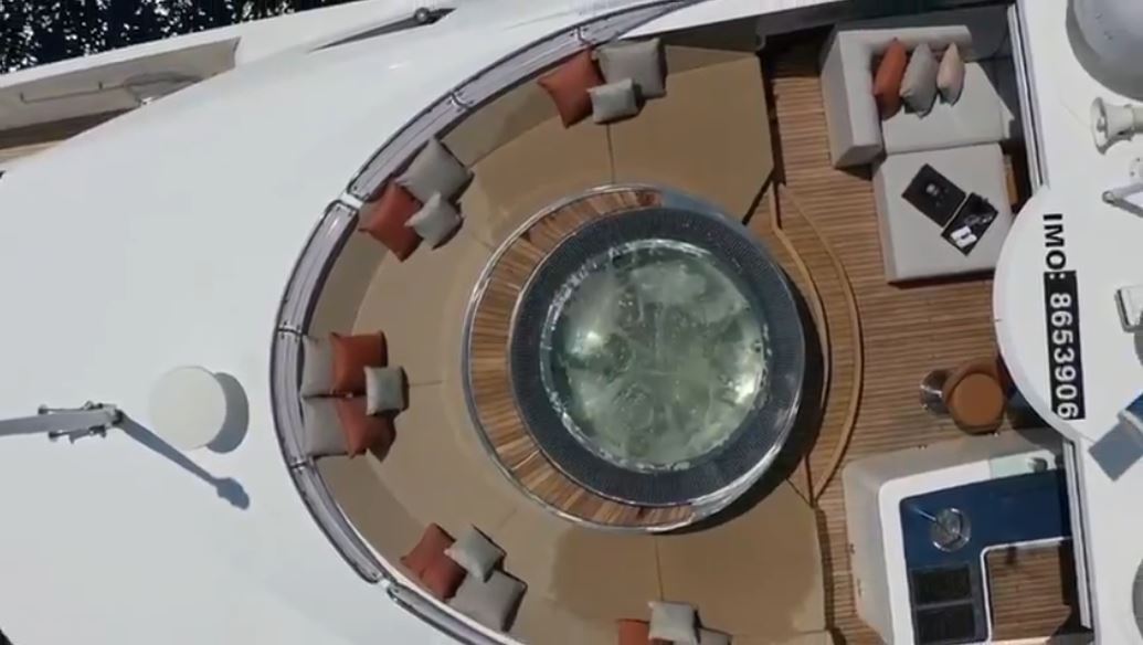 Conor McGregor, UFC fighter, is seated on Conor McGregor's Lamborghini as well as superyachts with pool and floating golf green.