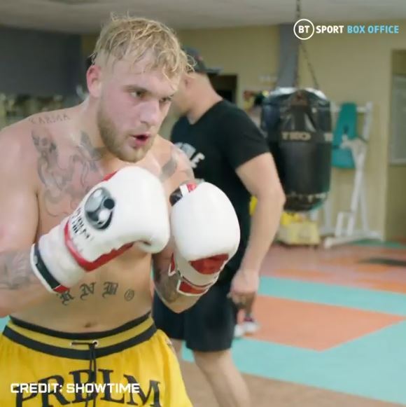 Watch Jake Paul and Tyron woodley train for fights with Floyd Mayweather's ex-UFC star.