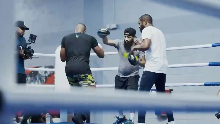 Watch Jake Paul and Tyron woodley train for fights with Floyd Mayweather's ex-UFC star.