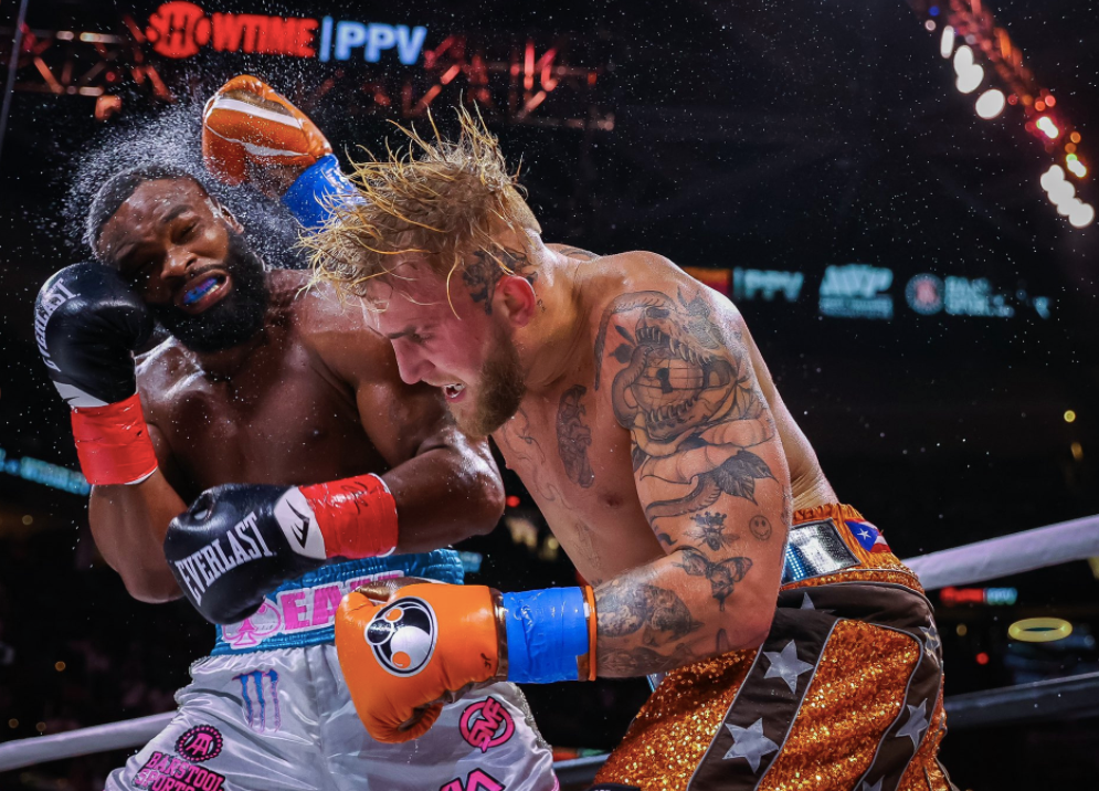 After overcoming the KO scare, Jake Paul wins his biggest pro boxing win with a split-decision victory over former UFC champ Tyron Woodley