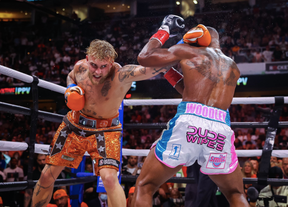 After overcoming the KO scare, Jake Paul wins his biggest pro boxing win with a split-decision victory over former UFC champ Tyron Woodley