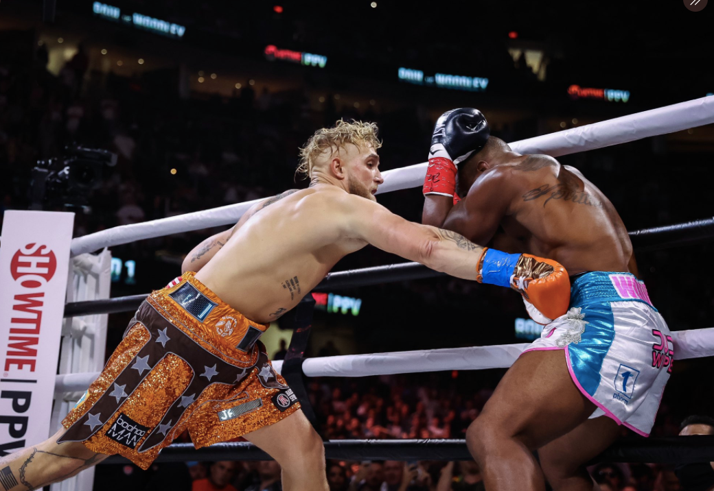 After overcoming the KO scare, Jake Paul wins his biggest pro boxing win with a split-decision victory over former UFC champ Tyron Woodley