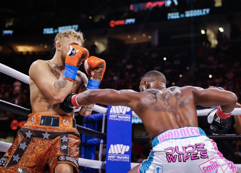 After overcoming the KO scare, Jake Paul wins his biggest pro boxing win with a split-decision victory over former UFC champ Tyron Woodley