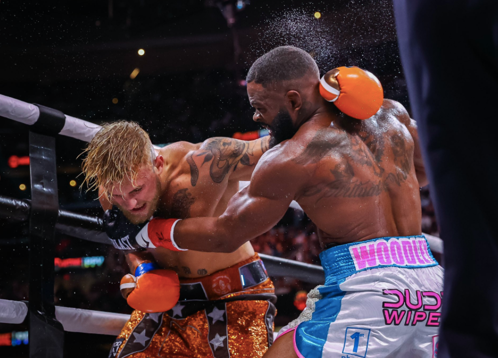 After overcoming the KO scare, Jake Paul wins his biggest pro boxing win with a split-decision victory over former UFC champ Tyron Woodley
