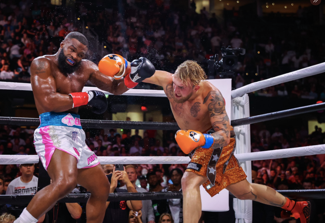 After overcoming the KO scare, Jake Paul wins his biggest pro boxing win with a split-decision victory over former UFC champ Tyron Woodley