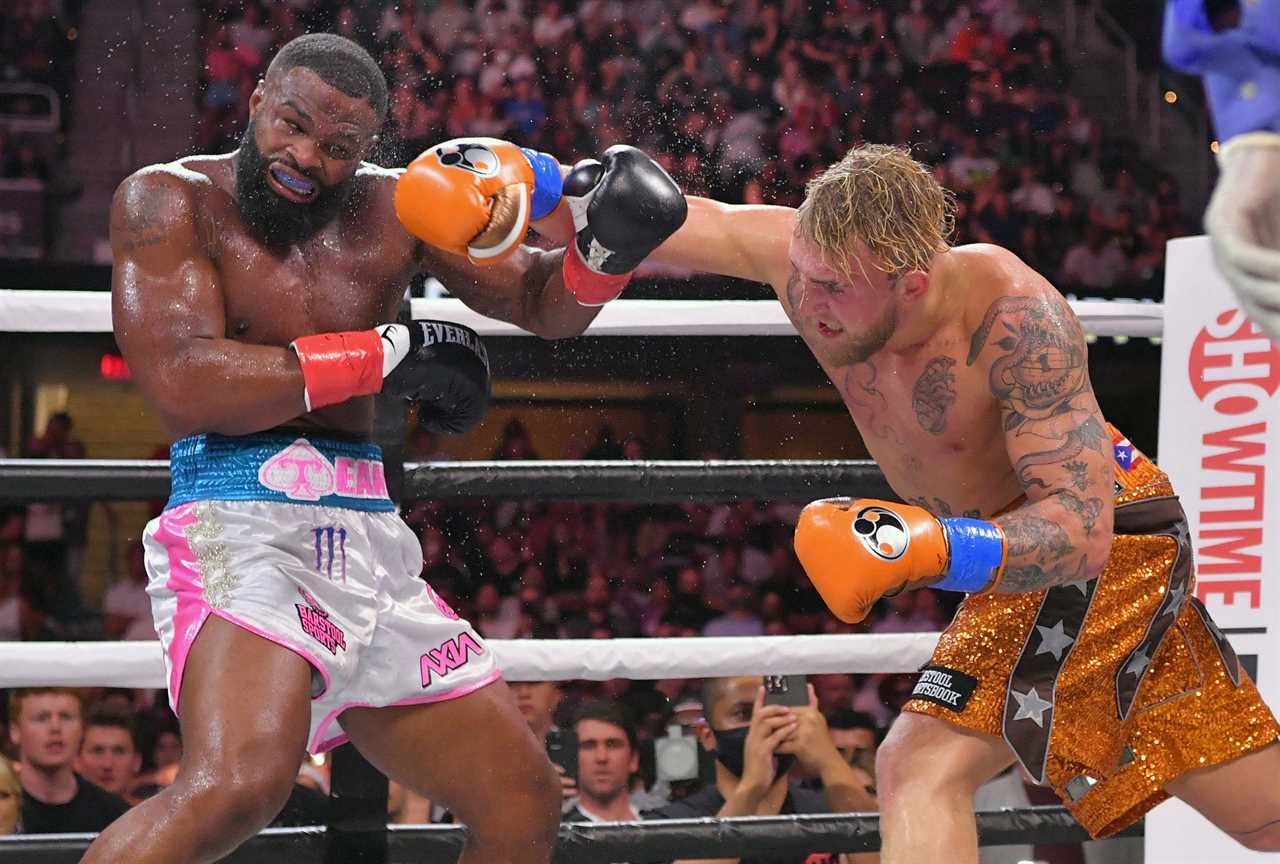 After their sons' brutal fight, Jake Paul and Tyron Woodley hugged their mothers in the ring.