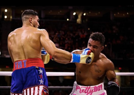 Molly-Mae Hague salutes Tommy Fury, the champion on Love Island. She dedicates Jake Paul's undercard win to her girlfriend