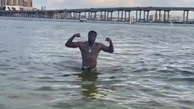 As he continues training for Tyson Fury, Deontay Wilder appears out of water in a slow-motion clip.