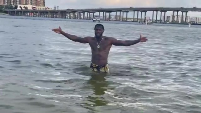 As he continues training for Tyson Fury, Deontay Wilder appears out of water in a slow-motion clip.