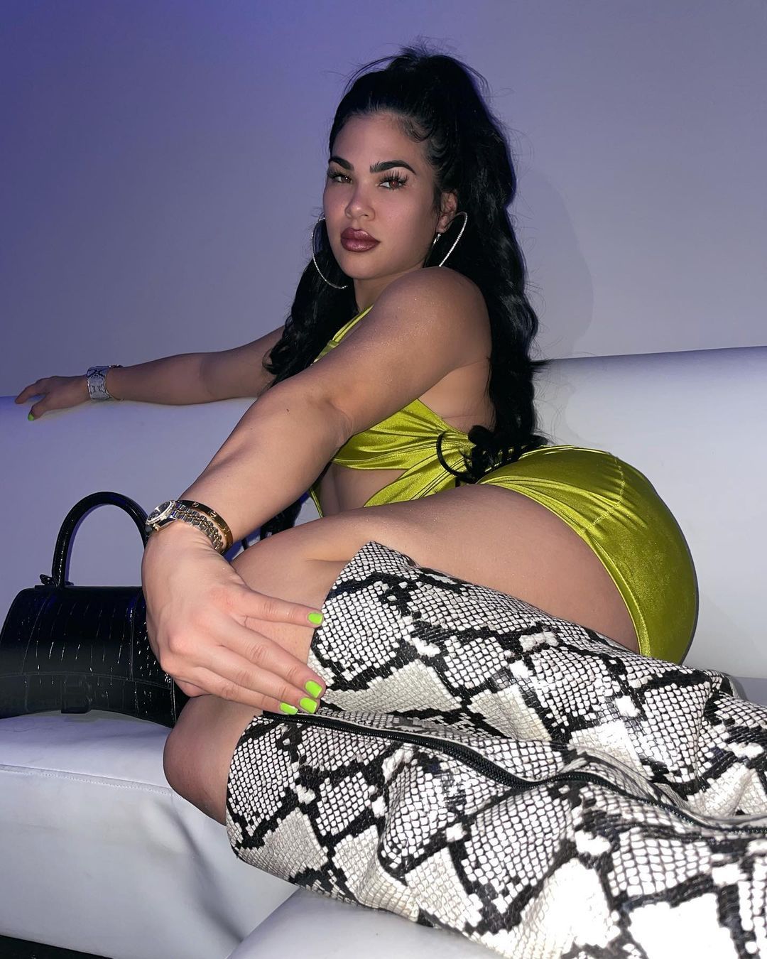 Rachael Ostovich, ex-UFC star, shows off her beautiful bikini body in revealing one piece while posing at sea on Instagram