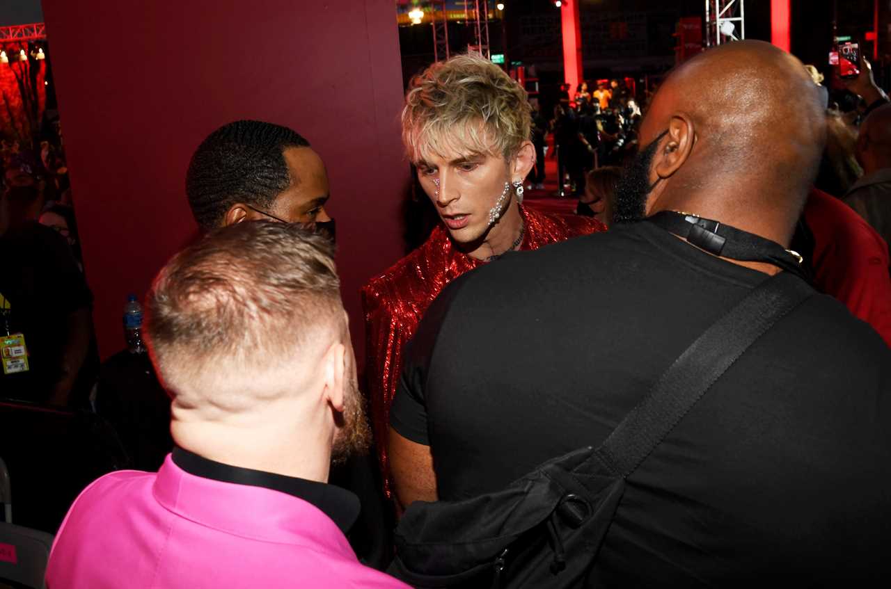 After a red carpet confrontation at MTV VMAs, Conor McGregor, UFC's star, labels Machine Gun Kelly a Vanilla Ice white boy rapper.