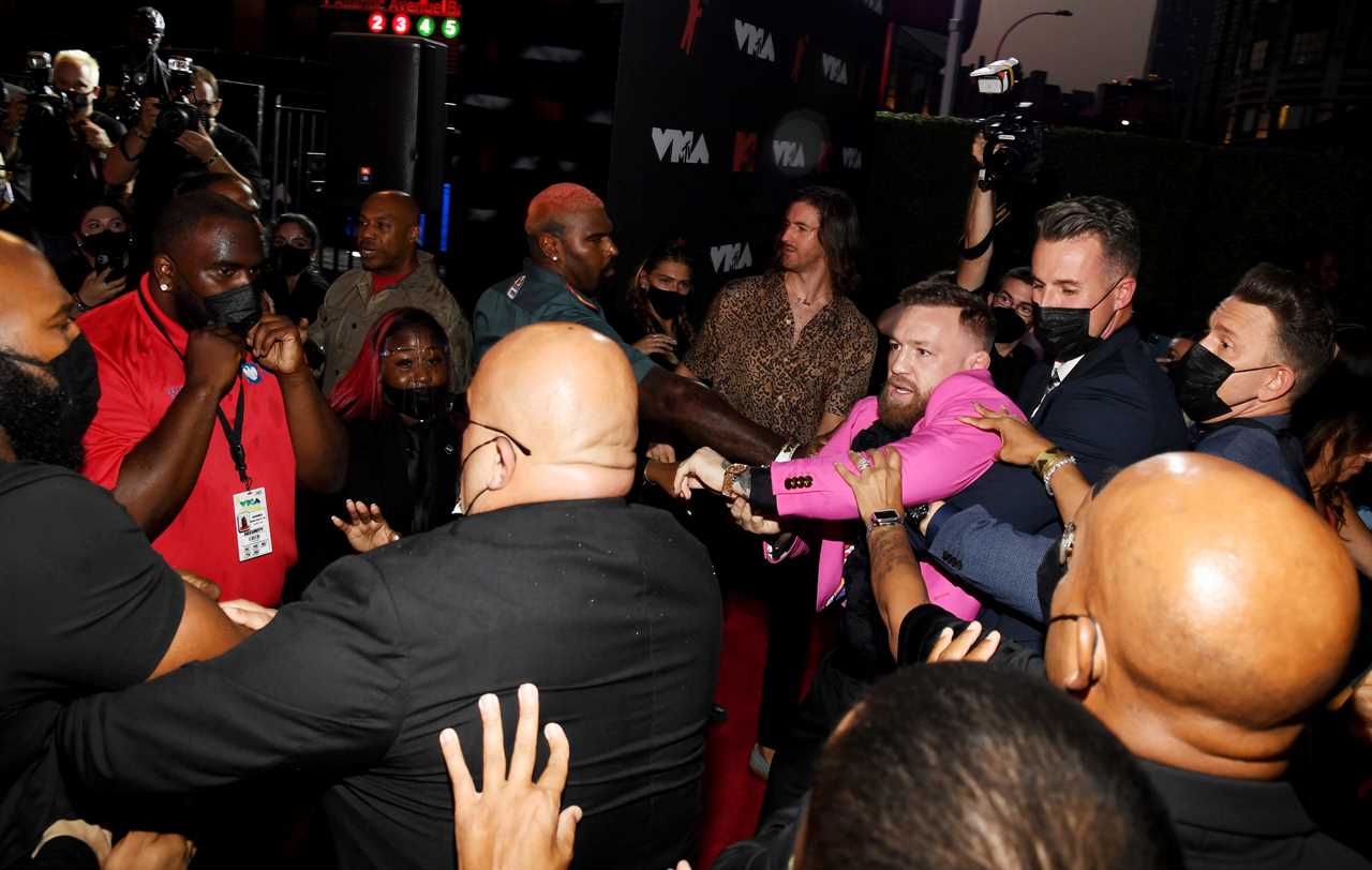 After a red carpet confrontation at MTV VMAs, Conor McGregor, UFC's star, labels Machine Gun Kelly a Vanilla Ice white boy rapper.