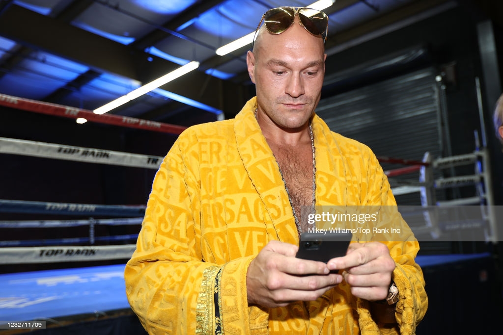 Tyson Fury checks his phone before his workout at the Top Rank Gym on May 4, 2021 in Las Vegas, Nevada.