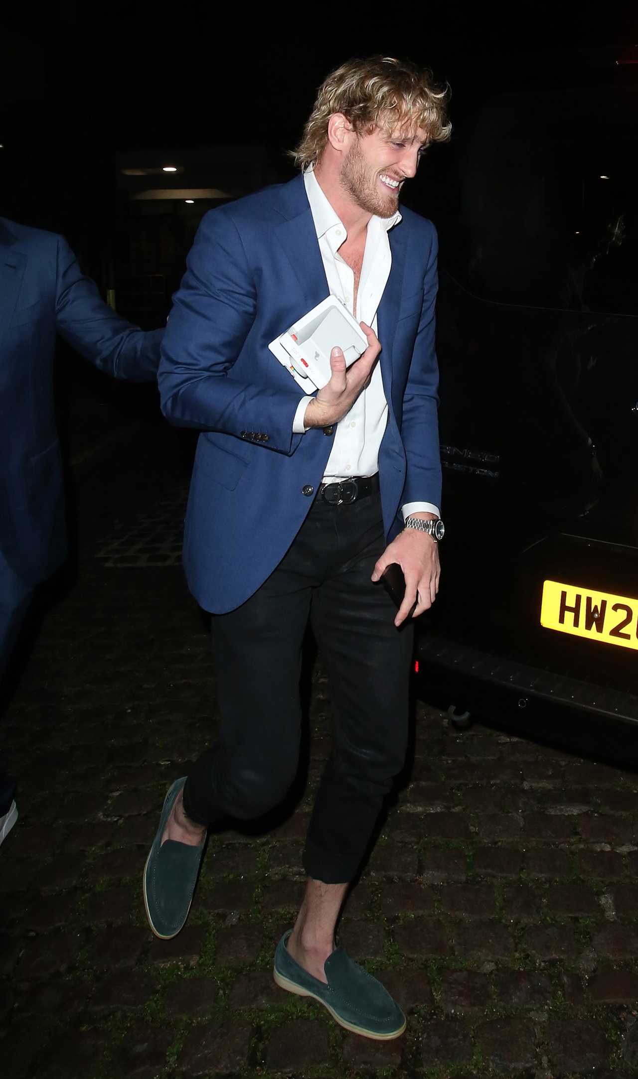 Logan Paul leaves Chiltern firehouse restaurant with stunning YouTube star and boxer who holds a Polaroid camera
