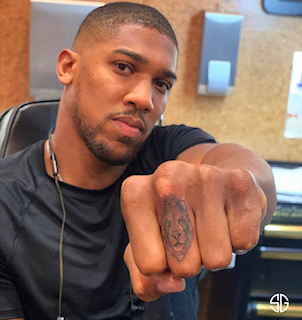 Anthony Joshua shows off his new inking