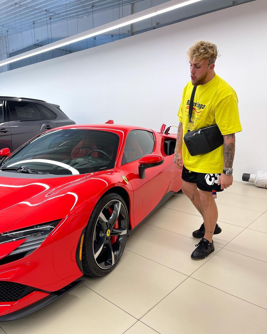 Jake Paul customizes his Ferrari SF90 Spider, worth PS400,000 plus, as a boxing star who makes a lot of cash following Tyron Woodley's win