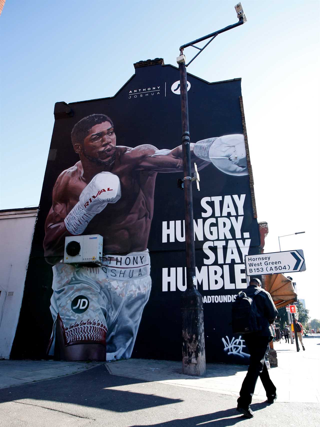 Anthony Joshua was 'honored' by a 40ft mural that was unveiled in Tottenham, just a stone's throw away from the Usyk fight stadium