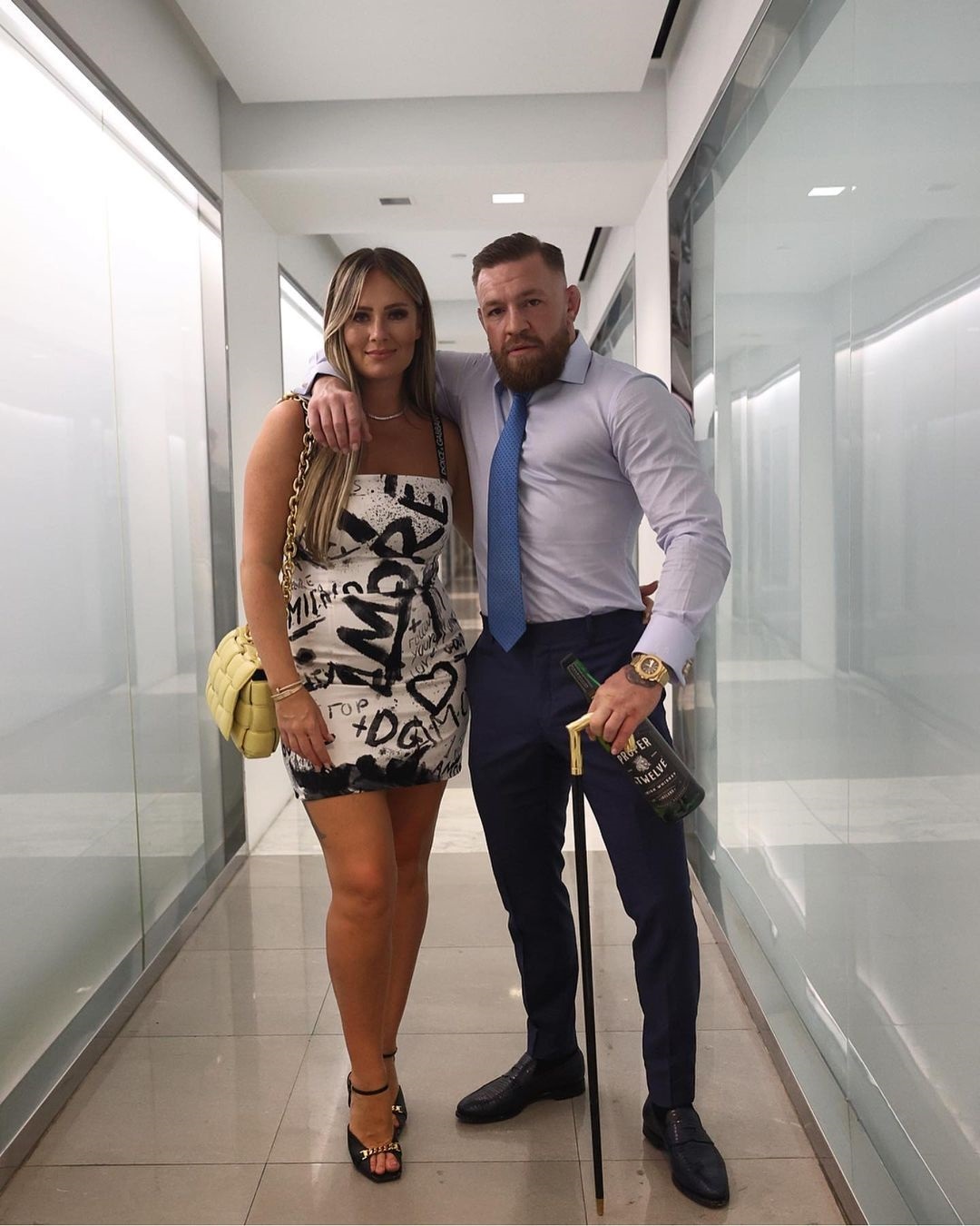 Dee Devlin looks stunning in a Dolce & Gabbana gown as she takes photos with Conor McGregor while the UFC star recovers from injury