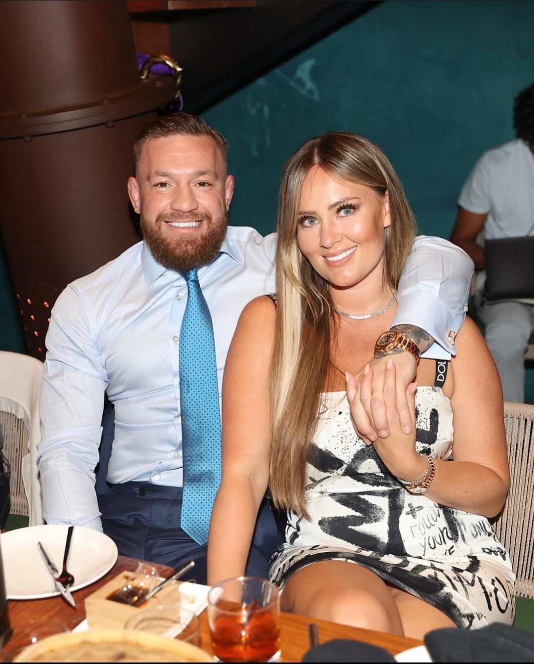 Dee Devlin looks stunning in a Dolce & Gabbana gown as she takes photos with Conor McGregor while the UFC star recovers from injury
