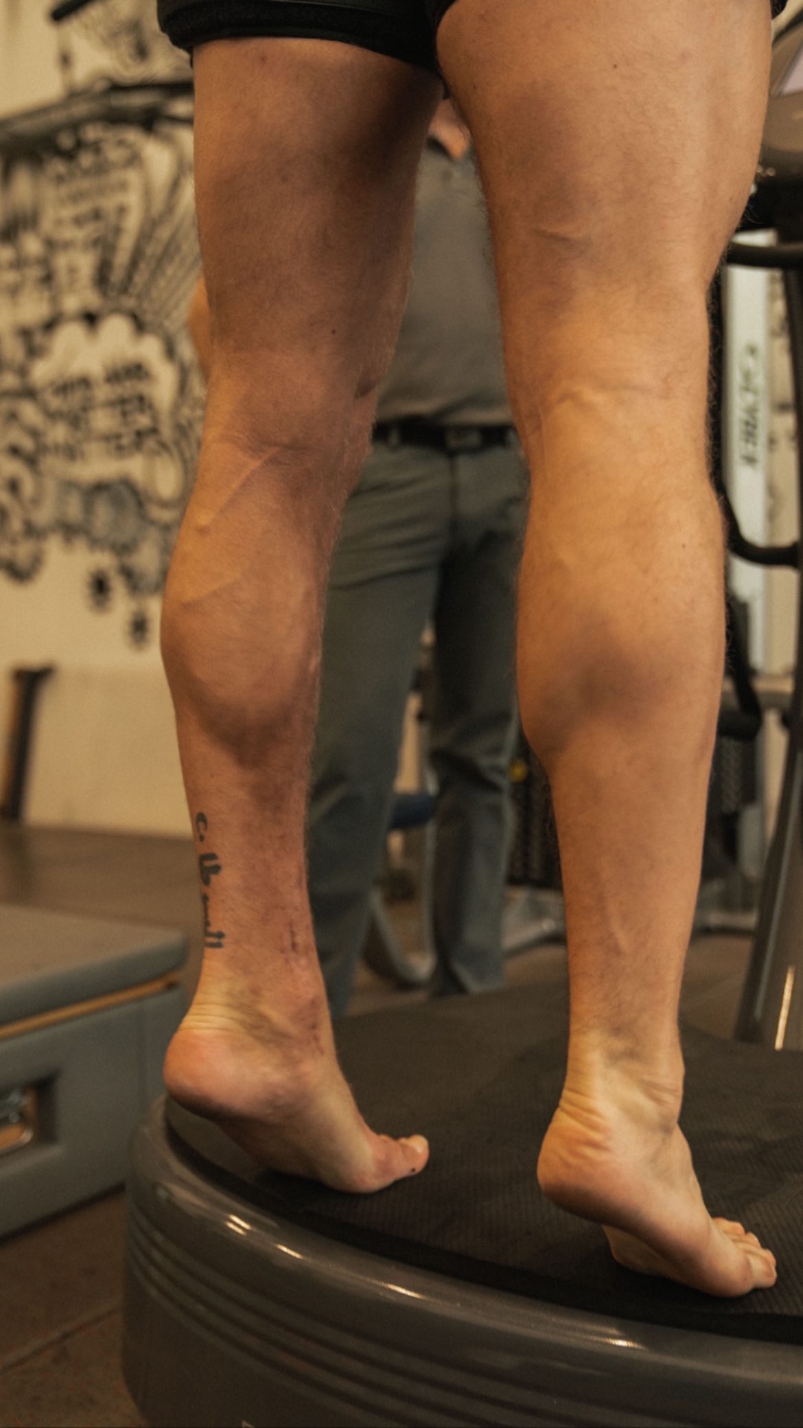 Conor McGregor's bulky calf muscles are displayed as he continues to recover from a horror-related broken leg.
