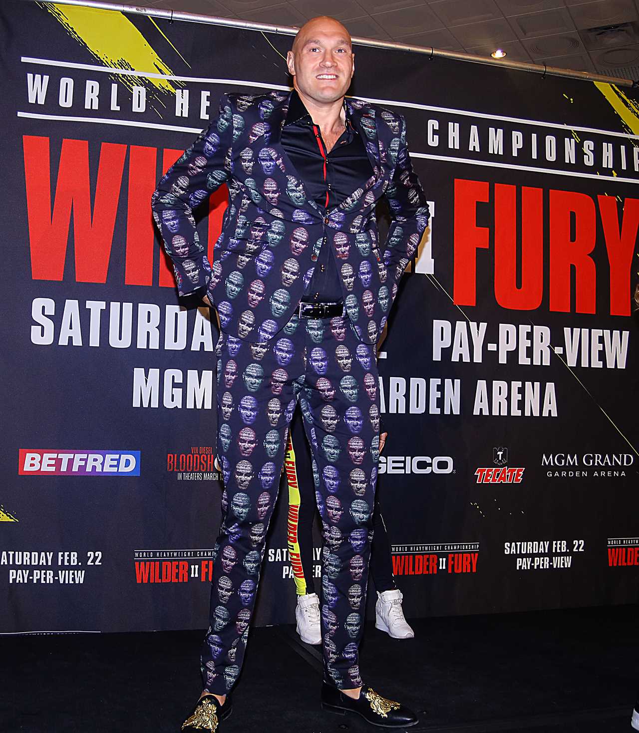 Deontay Wilder and Tyson Fury face off in fashion with custom suits, gold slippers, and diamond jewellery