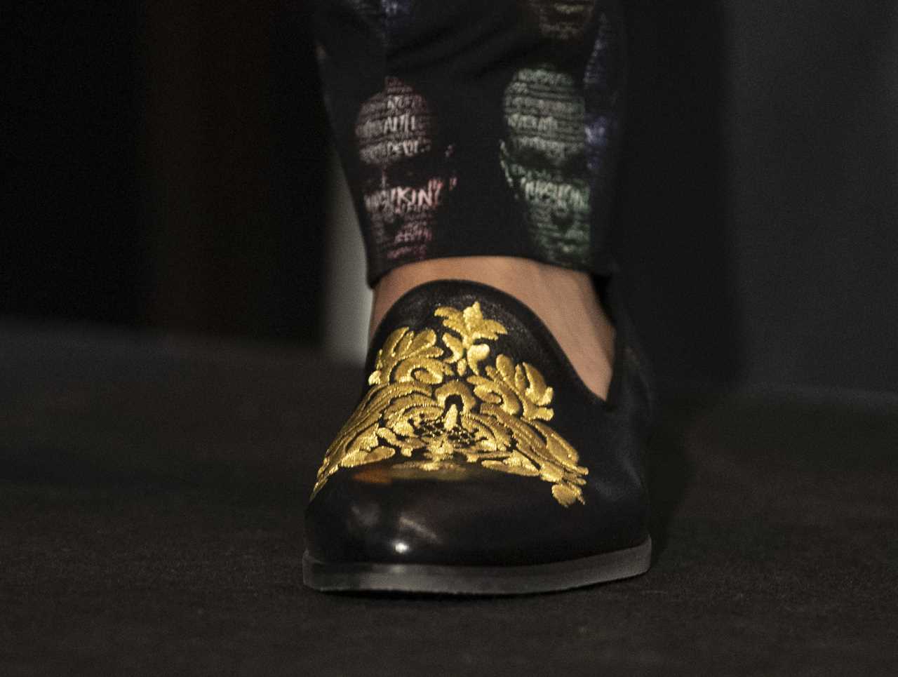Deontay Wilder and Tyson Fury face off in fashion with custom suits, gold slippers, and diamond jewellery