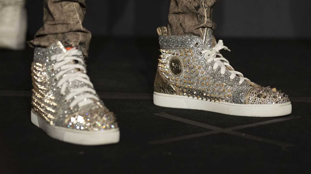 Deontay Wilder and Tyson Fury face off in fashion with custom suits, gold slippers, and diamond jewellery