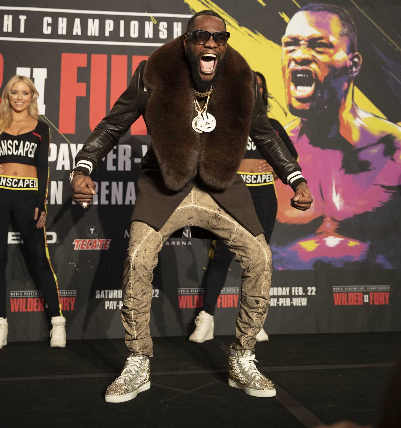 Deontay Wilder and Tyson Fury face off in fashion with custom suits, gold slippers, and diamond jewellery