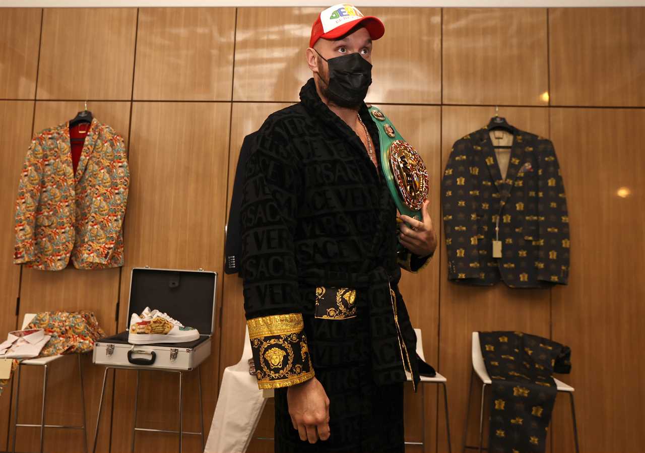 Fury appeared in a £375 Versace dressing gown when he spoke to the British media on Monday