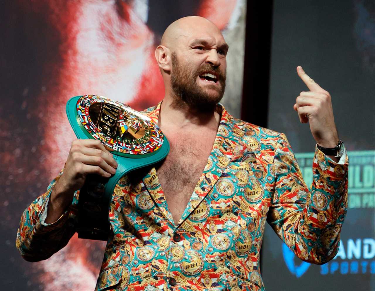 Tyson Fury's bespoke suit is decorated with WBC belts to taunt Deontay Wilder in advance of his fight