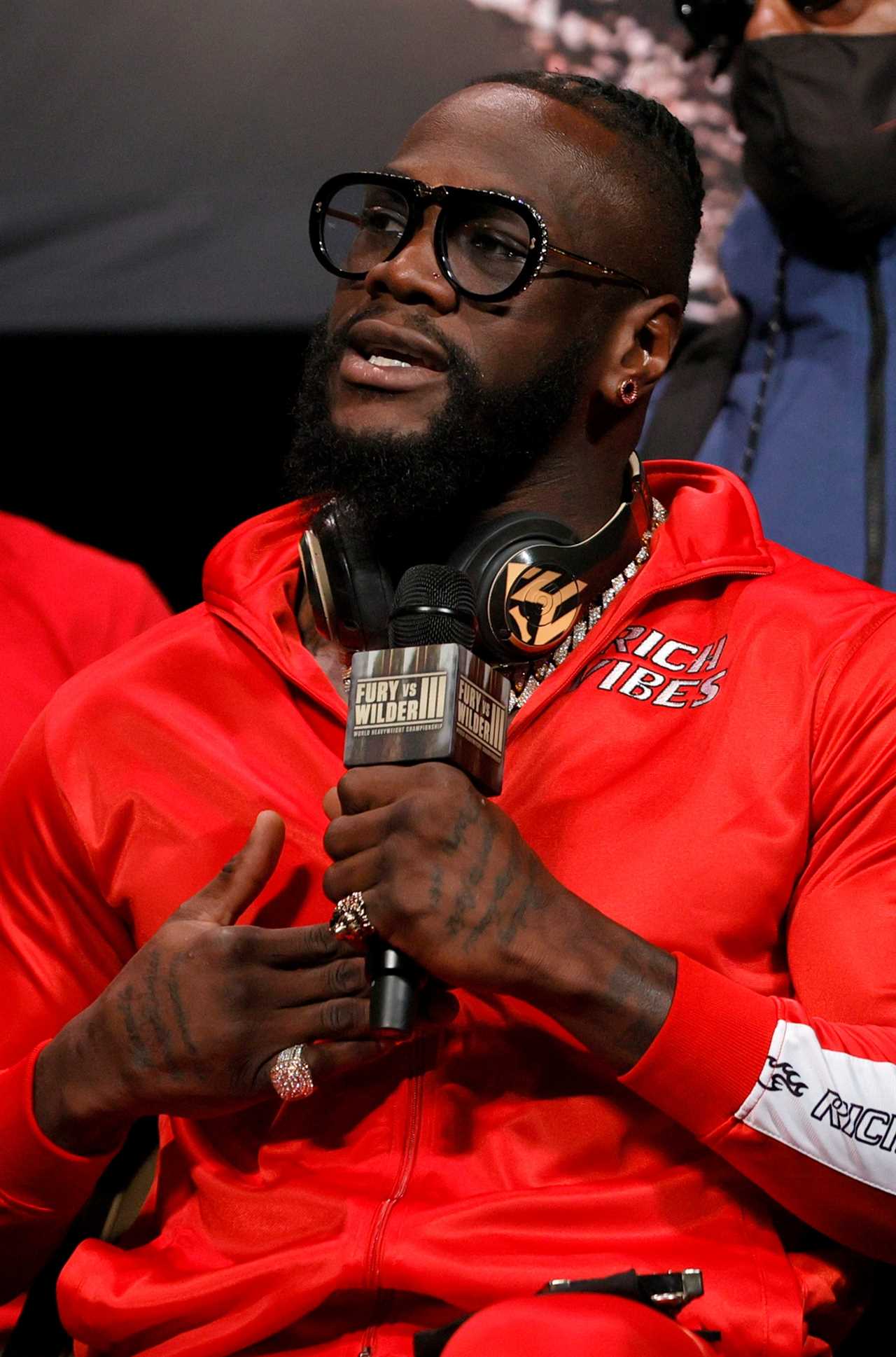 Tyson Fury's bespoke suit is decorated with WBC belts to taunt Deontay Wilder in advance of his fight