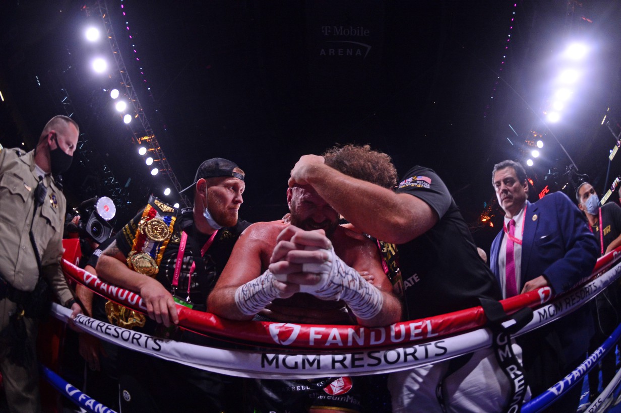 After winning thrilling KO over Deontay wilder, Tyson Fury was in tears.. before serenading the crowd with 'Walking in Vegas.