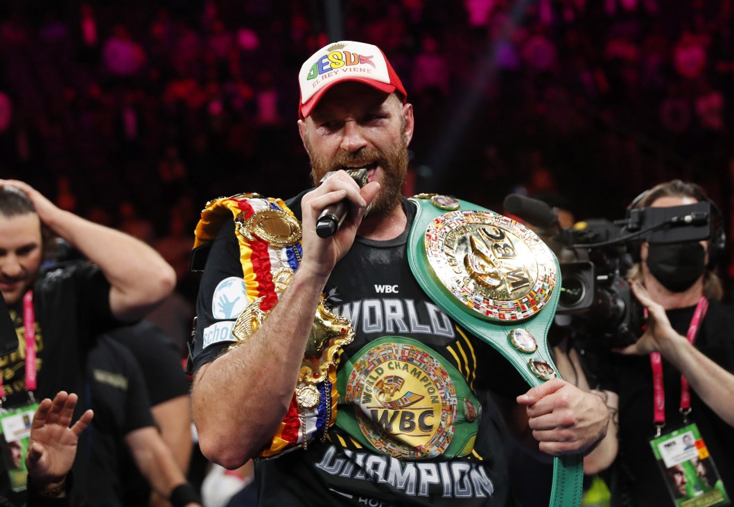 After winning thrilling KO over Deontay wilder, Tyson Fury was in tears.. before serenading the crowd with 'Walking in Vegas.