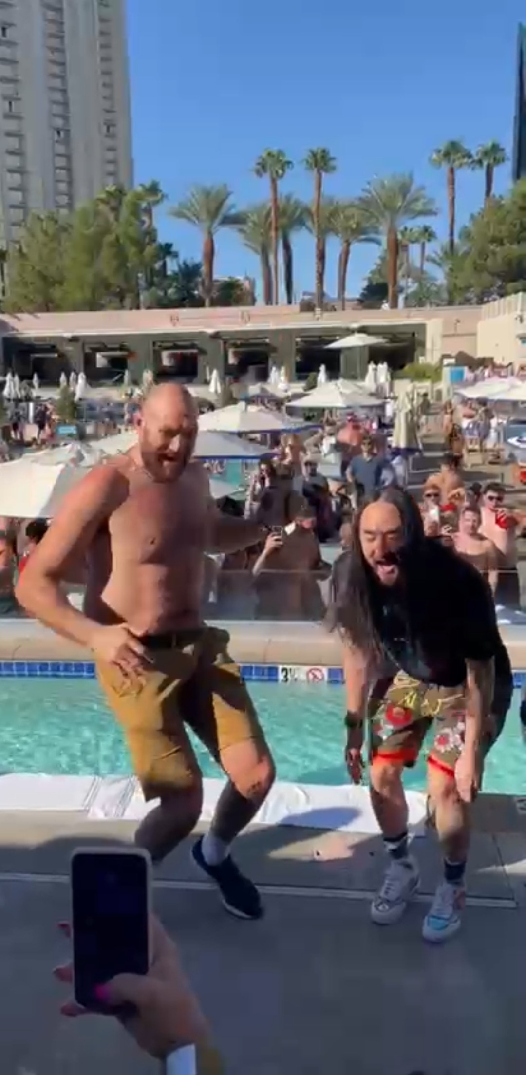 Tyson Fury enjoys a pool party with his wife Paris, brother Tommy, and friends while he displays the scars of war alongside Deontay Wilder