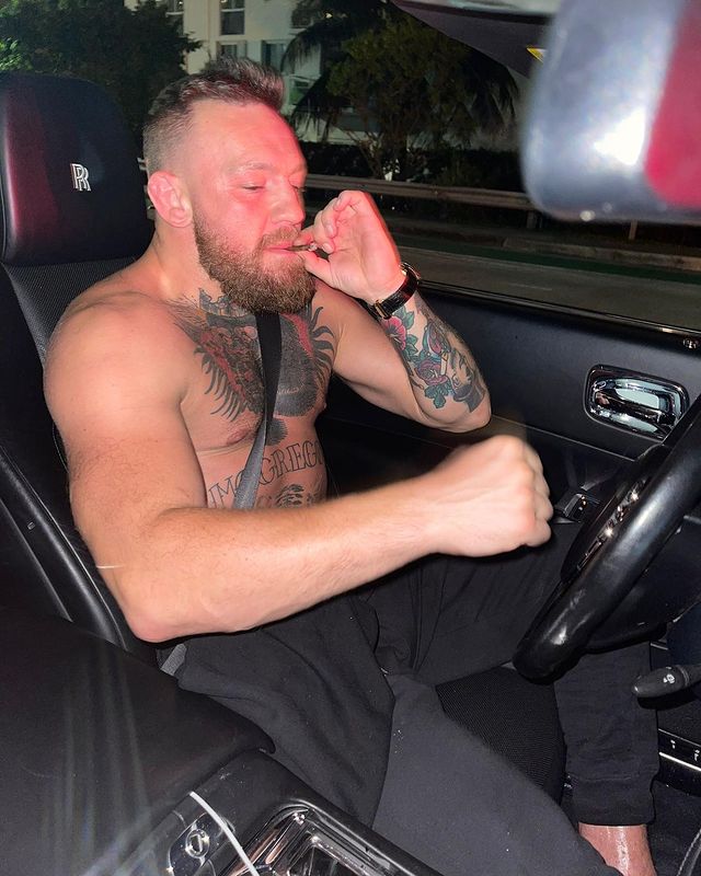 Conor McGregor brags about his wealth while driving a convertible Rolls-Royce around Miami.