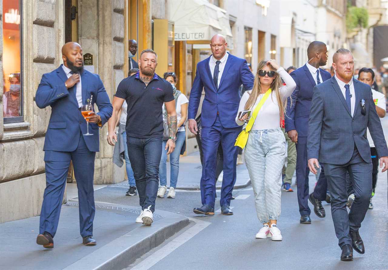 After being attacked by Rome fans, Conor McGregor was surrounded by a massive security team as he and Dee Devlin went to the shops.