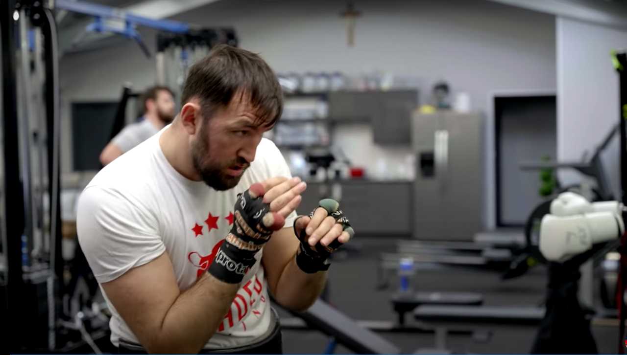 Tyson Fury's cousin Hughie constructs a personal gym in his back yard, defended by two gigantic Rottweilers before the Hammer fight