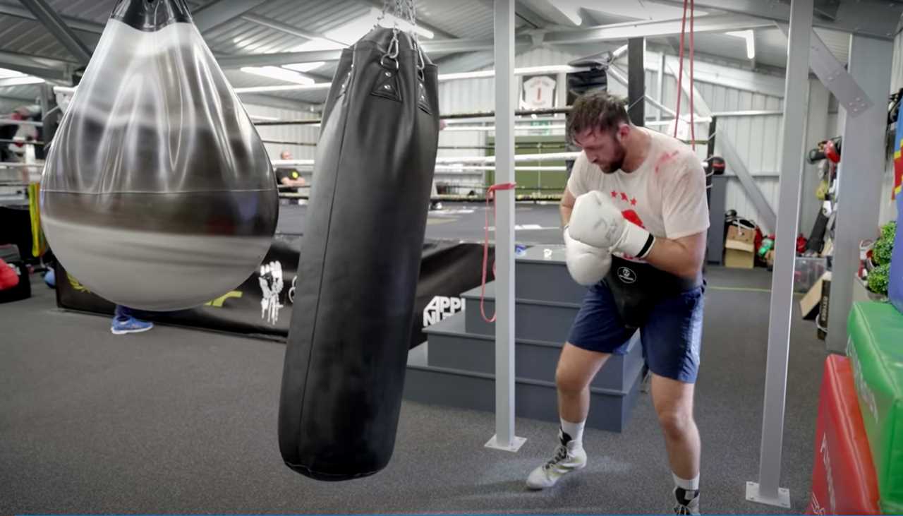 Tyson Fury's cousin Hughie constructs a personal gym in his back yard, defended by two gigantic Rottweilers before the Hammer fight