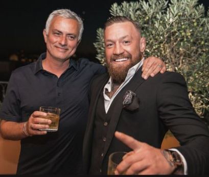 Conor McGregor drinks whiskey with Jose Mourinho after UFC star receives Roma shirt from the Vatican.