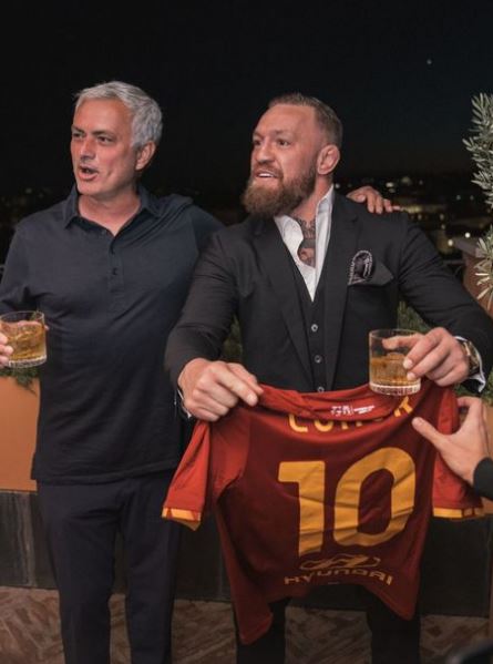 Conor McGregor drinks whiskey with Jose Mourinho after UFC star receives Roma shirt from the Vatican.