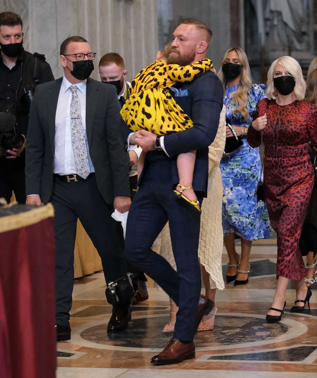 Conor McGregor and Dee Devlin, their fiancee, have a ceremony at the Vatican to mark Rian's christening.