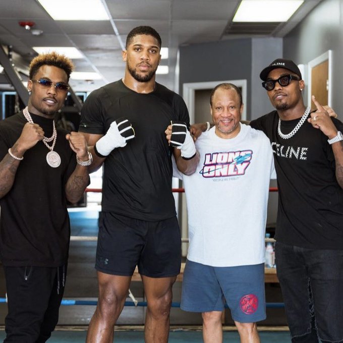 Anthony Joshua is pictured with the Charlo brothers, American boxing trainer Ronnie Shields, as he continues his tour of US gyms