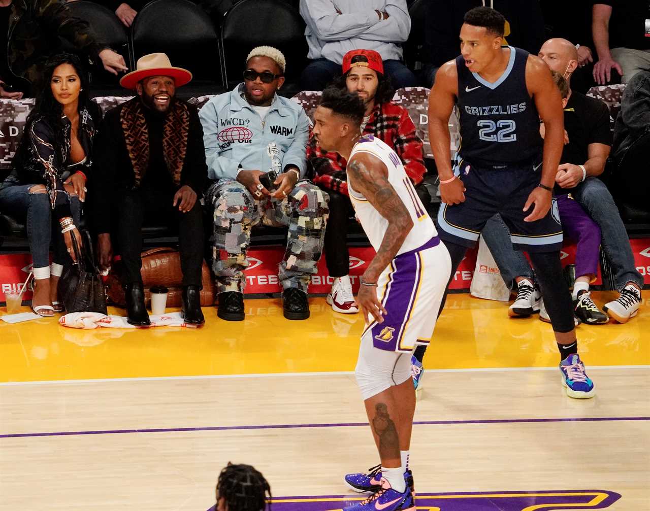 After a $5m claim by Gallienne Nabila, Floyd Mayweather is seen sitting courtside with Gallienne Nabila, his ex-girlfriend.