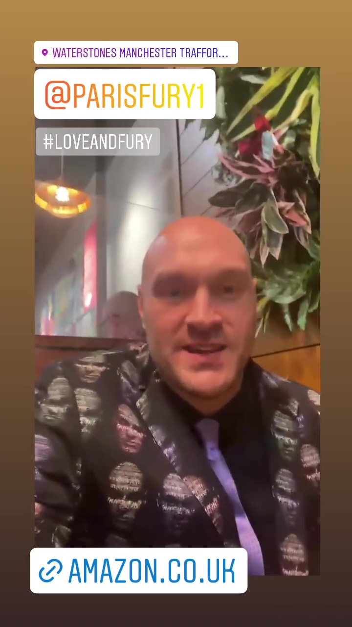 Tyson Fury's suit is covered up with his face while attending the Paris book launch by his wife at Trafford Centre