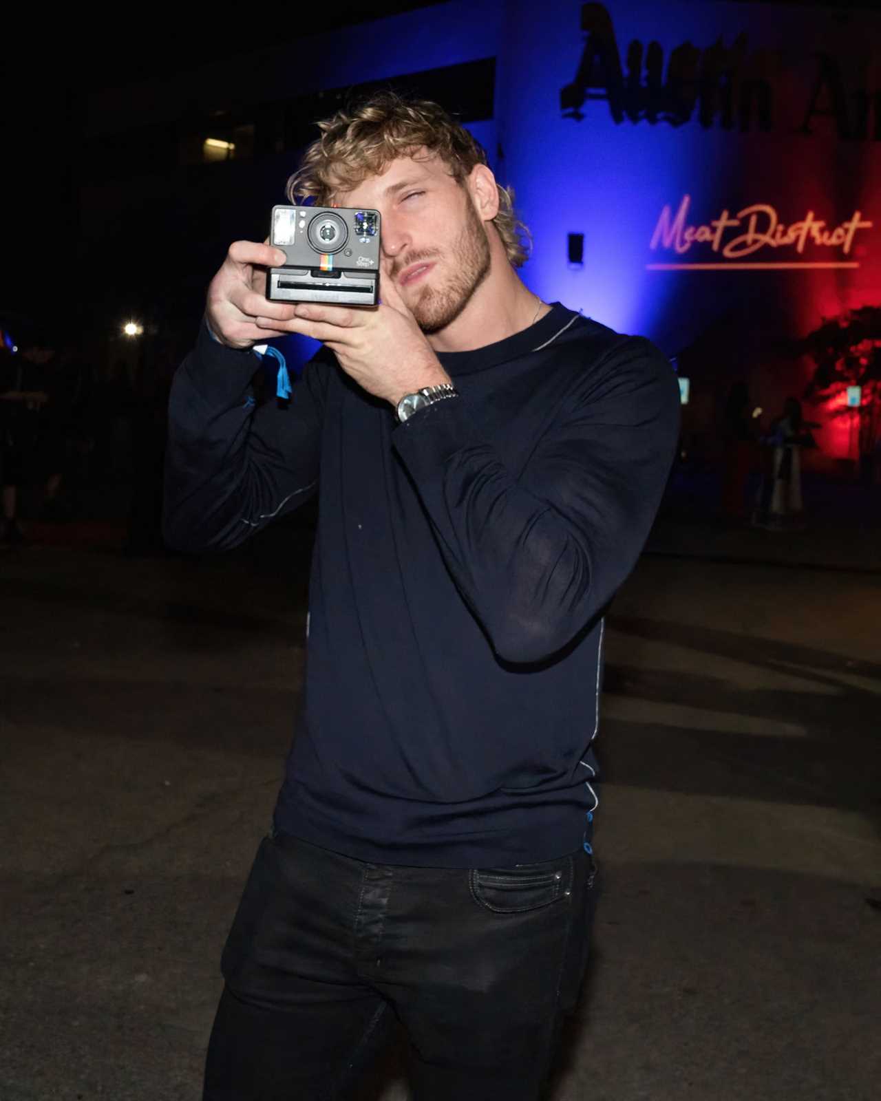 Logan Paul is seen in a spat outside an LA nightclub. The footage appears to show him striking at a fan who calls him a p***y.
