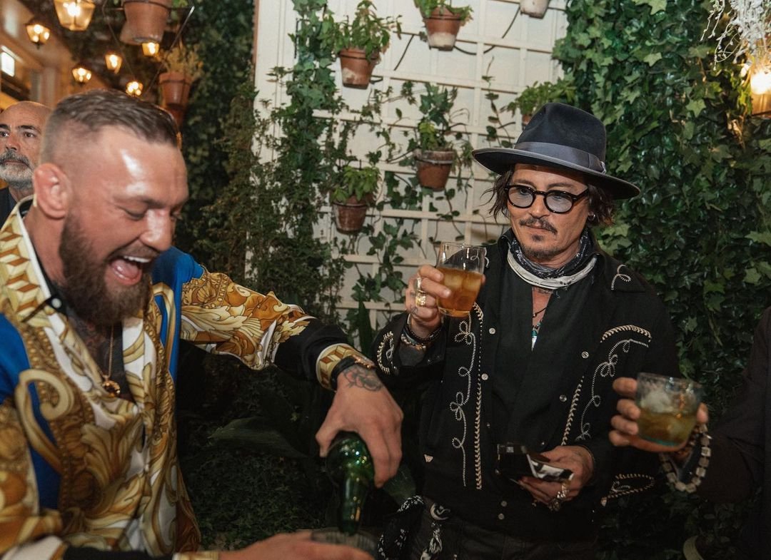 Johnny Depp and Conor McGregor share a whiskey when UFC star Dee Devlin meets 'Pirates of the Caribbean actor' in Rome.