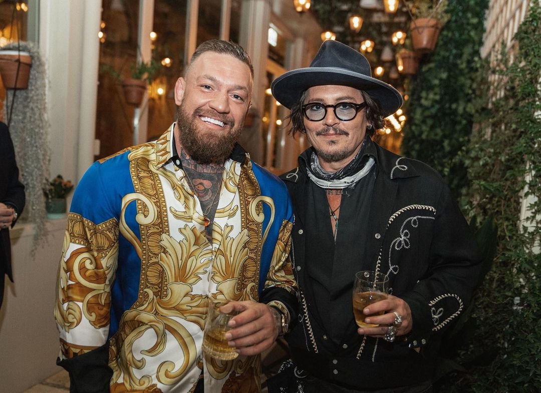 Johnny Depp and Conor McGregor share a whiskey when UFC star Dee Devlin meets 'Pirates of the Caribbean actor' in Rome.