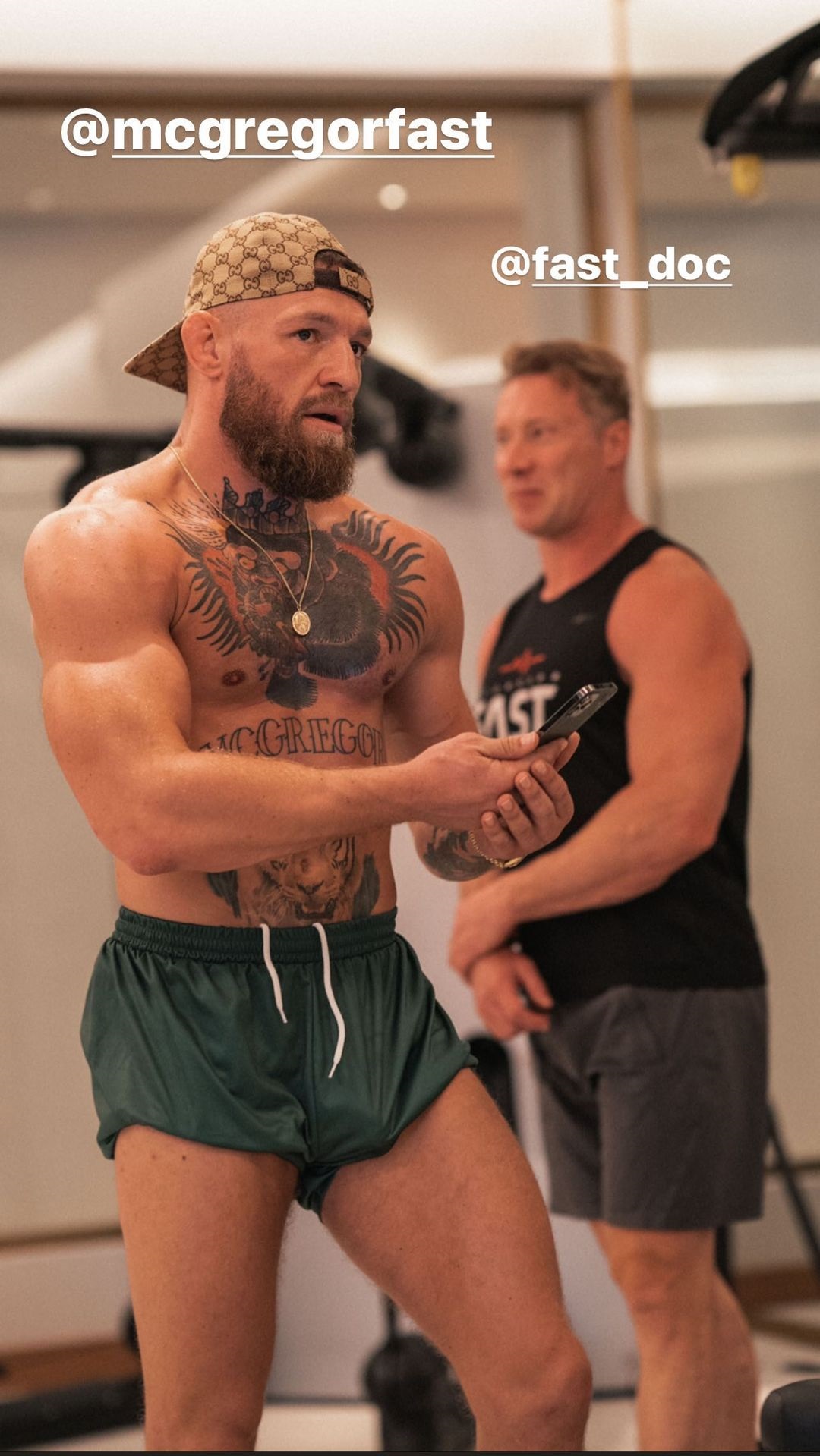 Conor McGregor displays bulging biceps as he bulks up to make a charity fight night appearance at UFC.