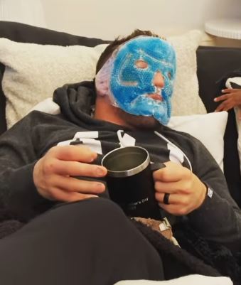 UFC star Michael Chandler is forced to wear an ice mask after his face was 'unrecognisable to his son' after a brutal Gaethje fight