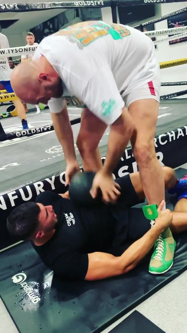 Topless Jake Paul runs in a special altitude training mask while responding to Tyson Fury and Tommy's training video